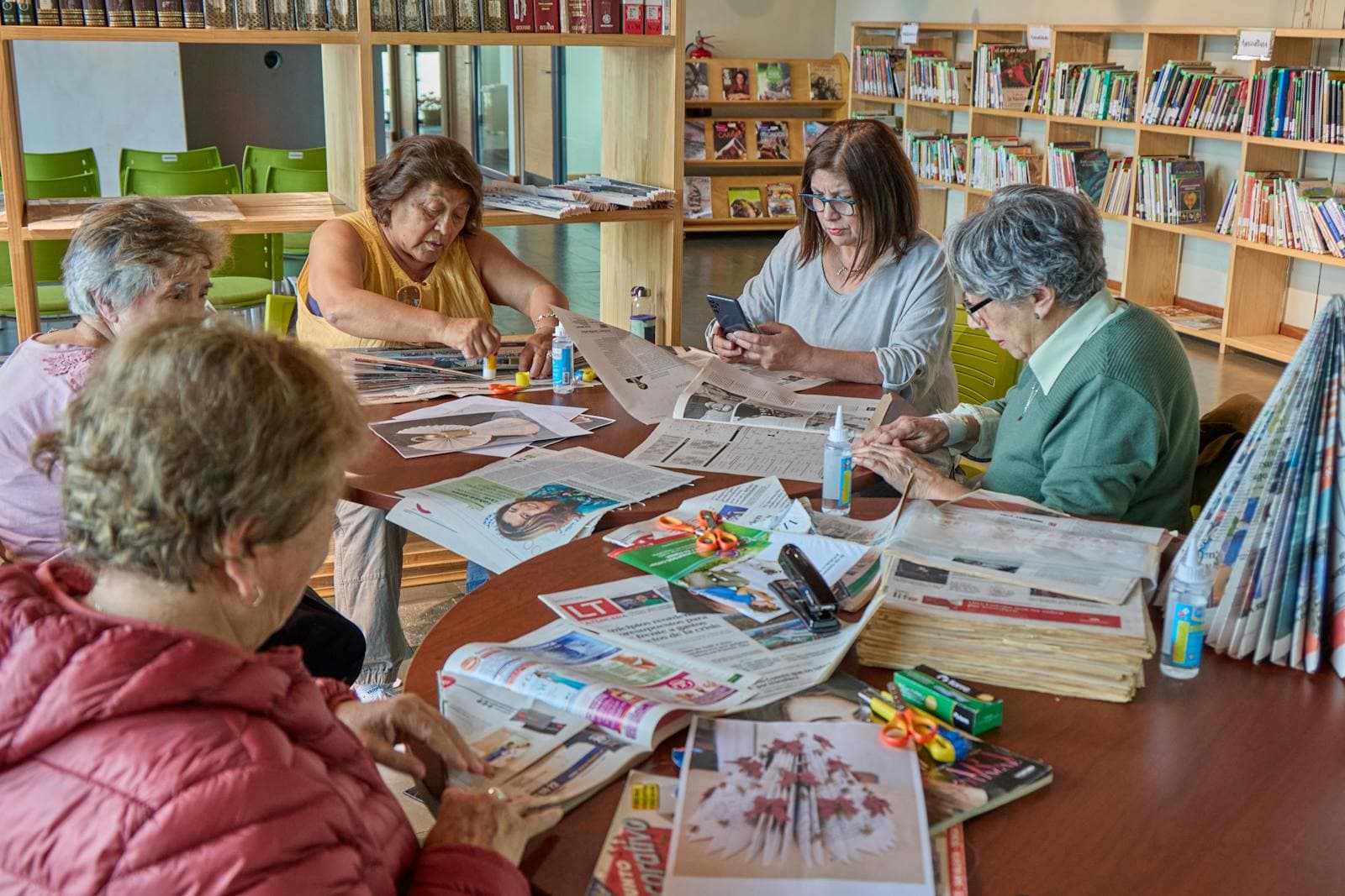 Senior adults craft together in a community space — companion-coordinated social engagement.